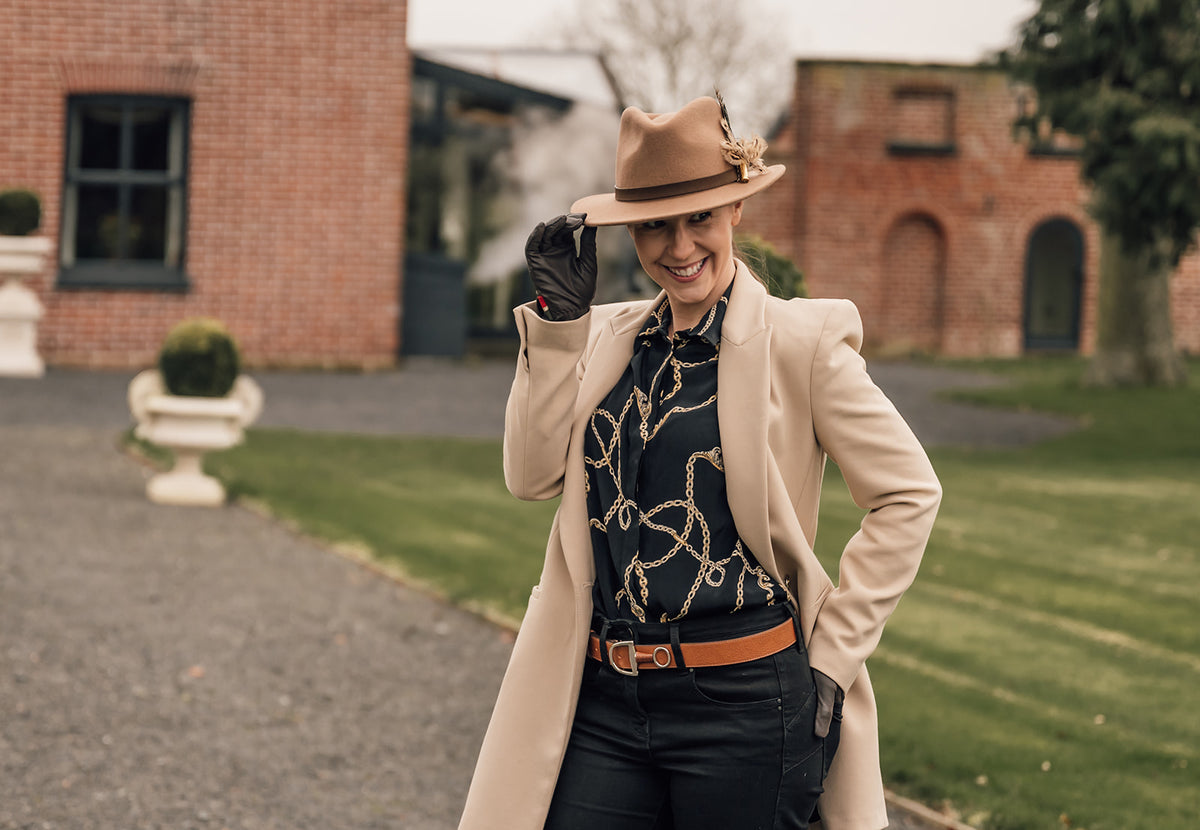 Fedora and feather pin styled at Burlton Manor