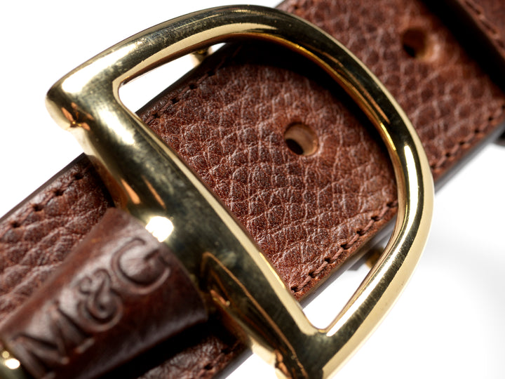 Close-up of a Windsor gold-tone buckle and textured leather