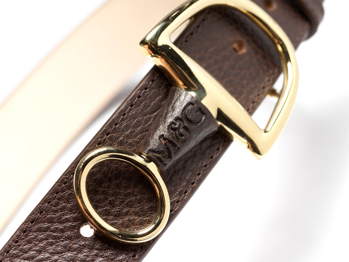 Close-up of a dark brown Windsor belt with gold-tone fittings