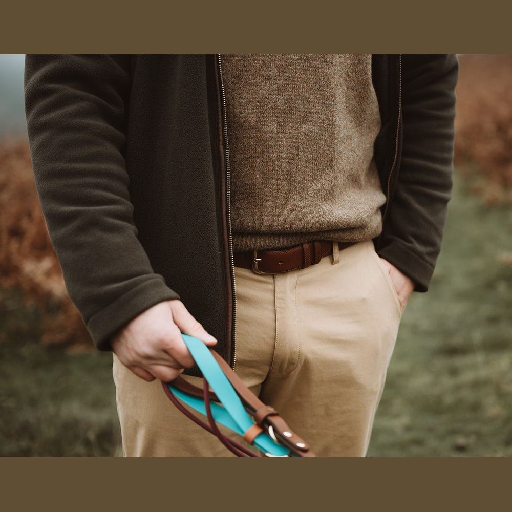 Close-up of a turquoise Biothane lead handle in the handler&