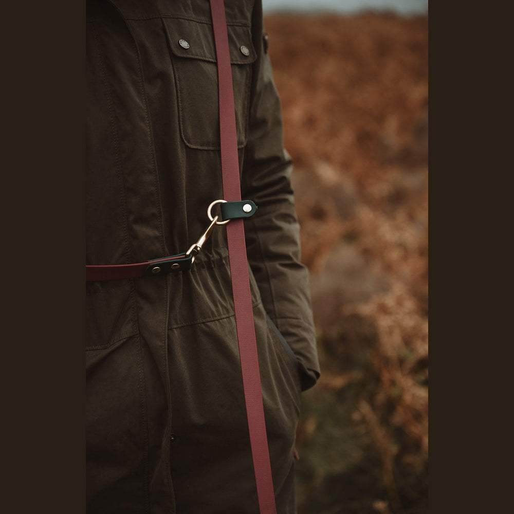 Biothane multi-way lead clip and ring detail on a coat