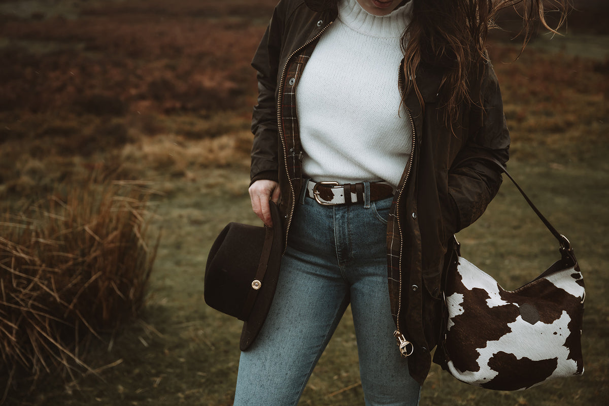 Hair-on-hide shoulder bag styled in the countryside