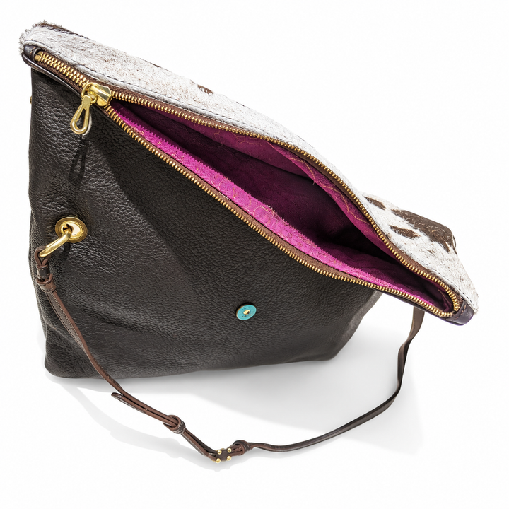 Open Stowfold bag showing the zip and purple interior