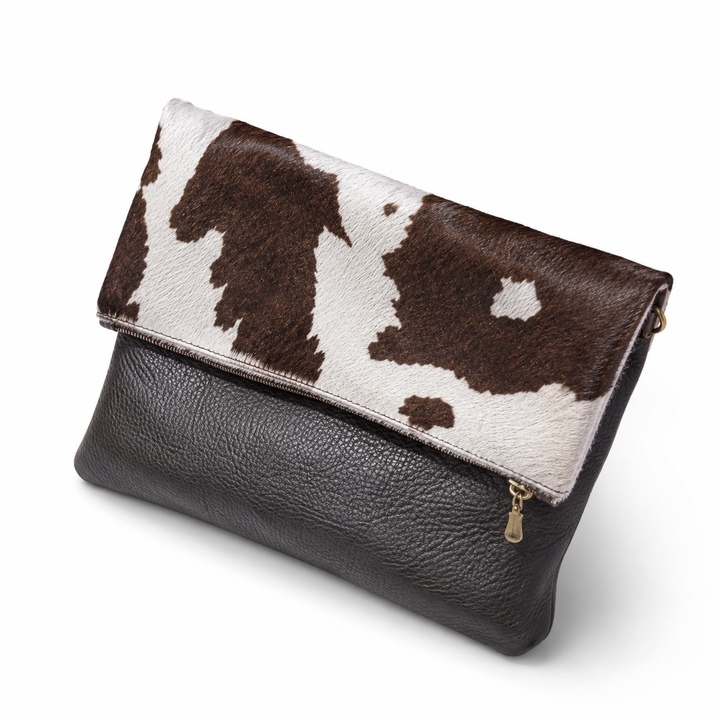 Stowfold black leather bag with brown-and-white cowhide flap