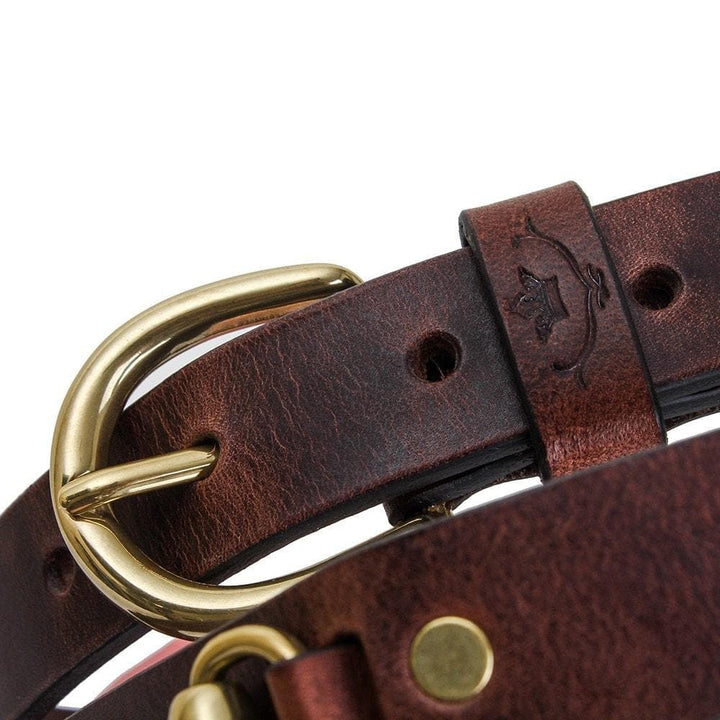 Close-up of the Badminton dark brown leather buckle and embossed keeper