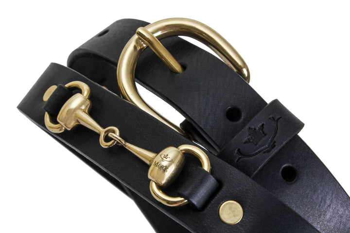 Close-up of the Badminton black leather belt with gold-tone snaffle fittings
