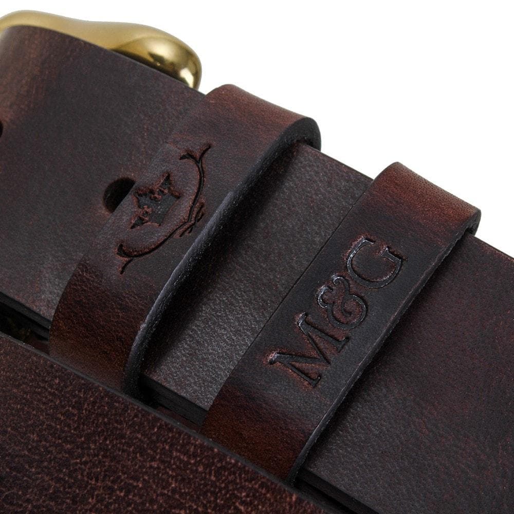 Close-up of dark brown Chester belt keepers with embossed initials