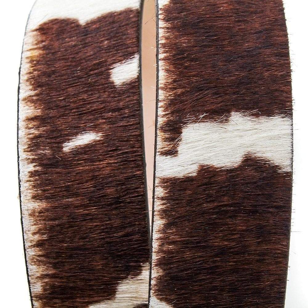 Close-up of natural brown-and-white hide markings on Ledbury belts