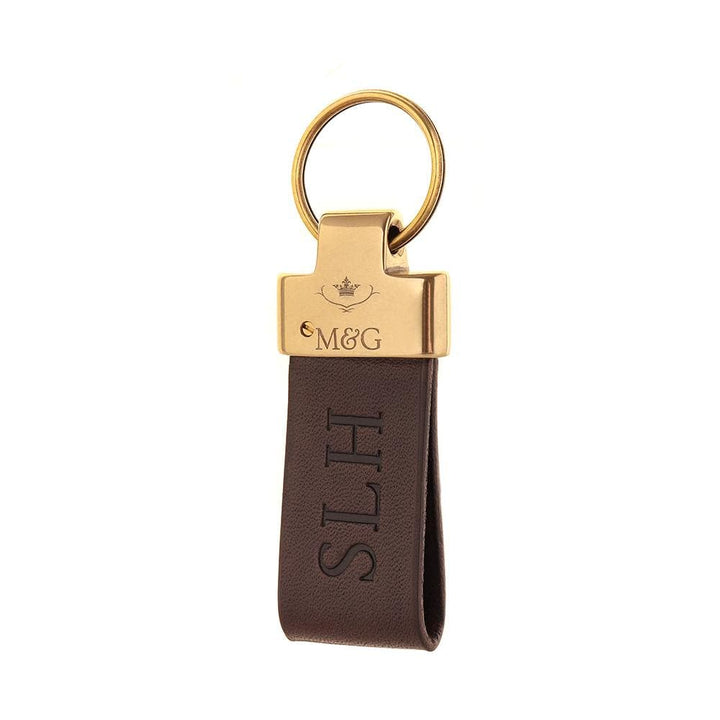 Brown M&amp;G leather keyring with gold-tone fittings and blind-embossed initials