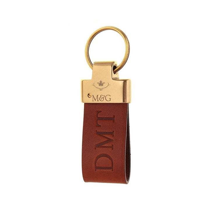 Tan M&amp;G leather keyring with gold-tone fittings and blind-embossed initials