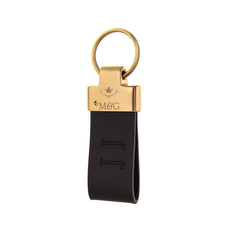 Dark M&amp;G leather keyring with gold-tone fittings and blind-embossed initials