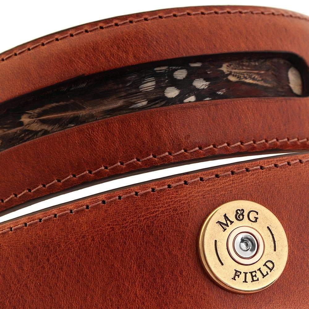Close-up of the Warwick tan leather feather panel and cartridge detail