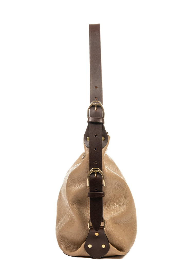 Side view of a neutral Clifton Tote showing strap attachments