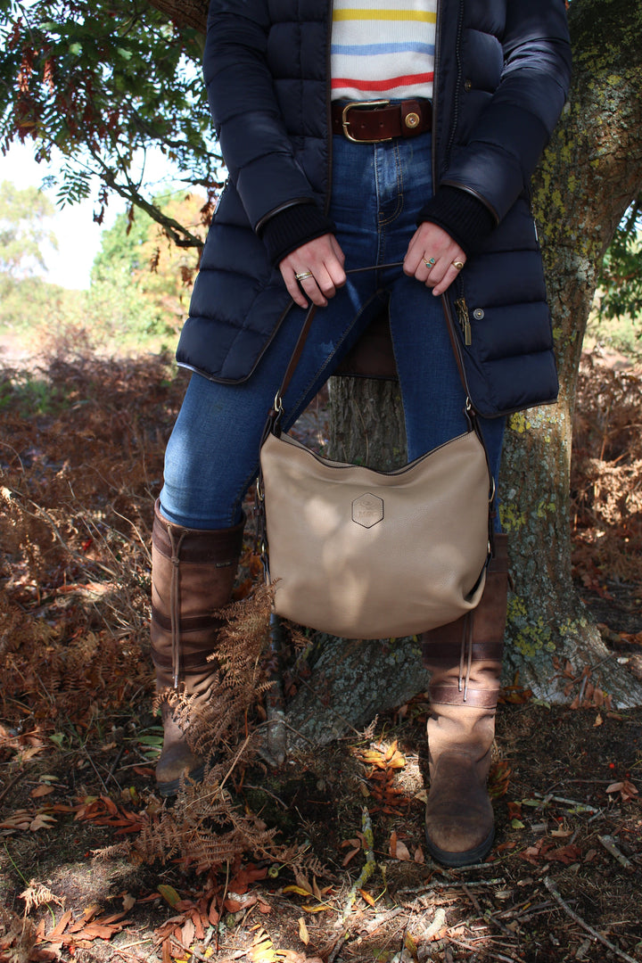 Clifton Tote carried outdoors with a navy coat and boots