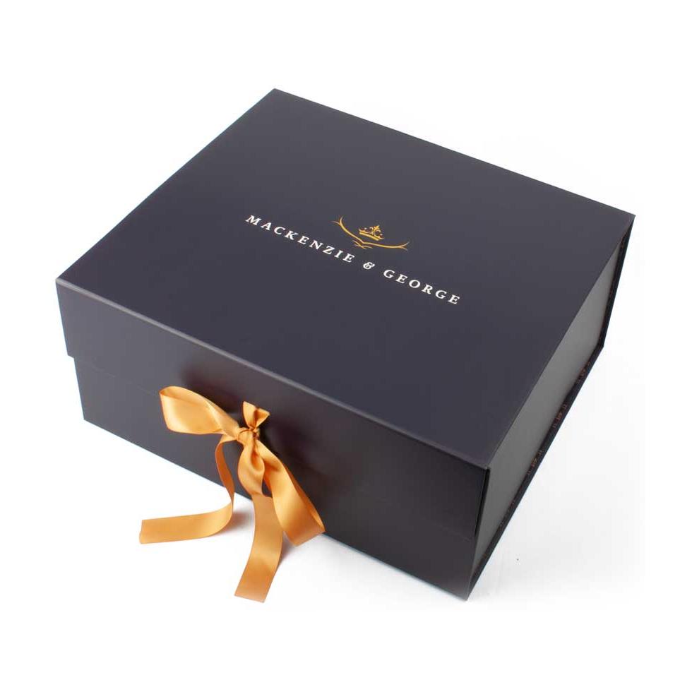 Mackenzie & George hat box tied with a gold ribbon