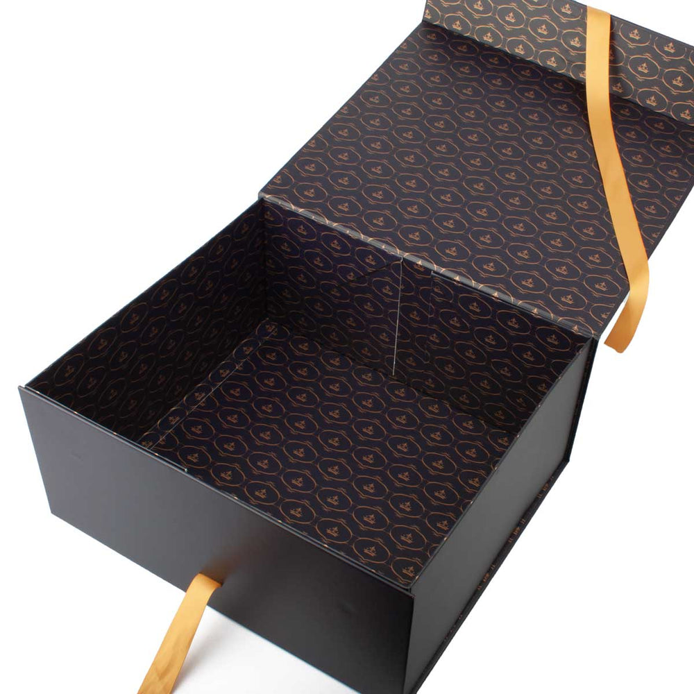 Open Mackenzie & George hat box showing patterned lining